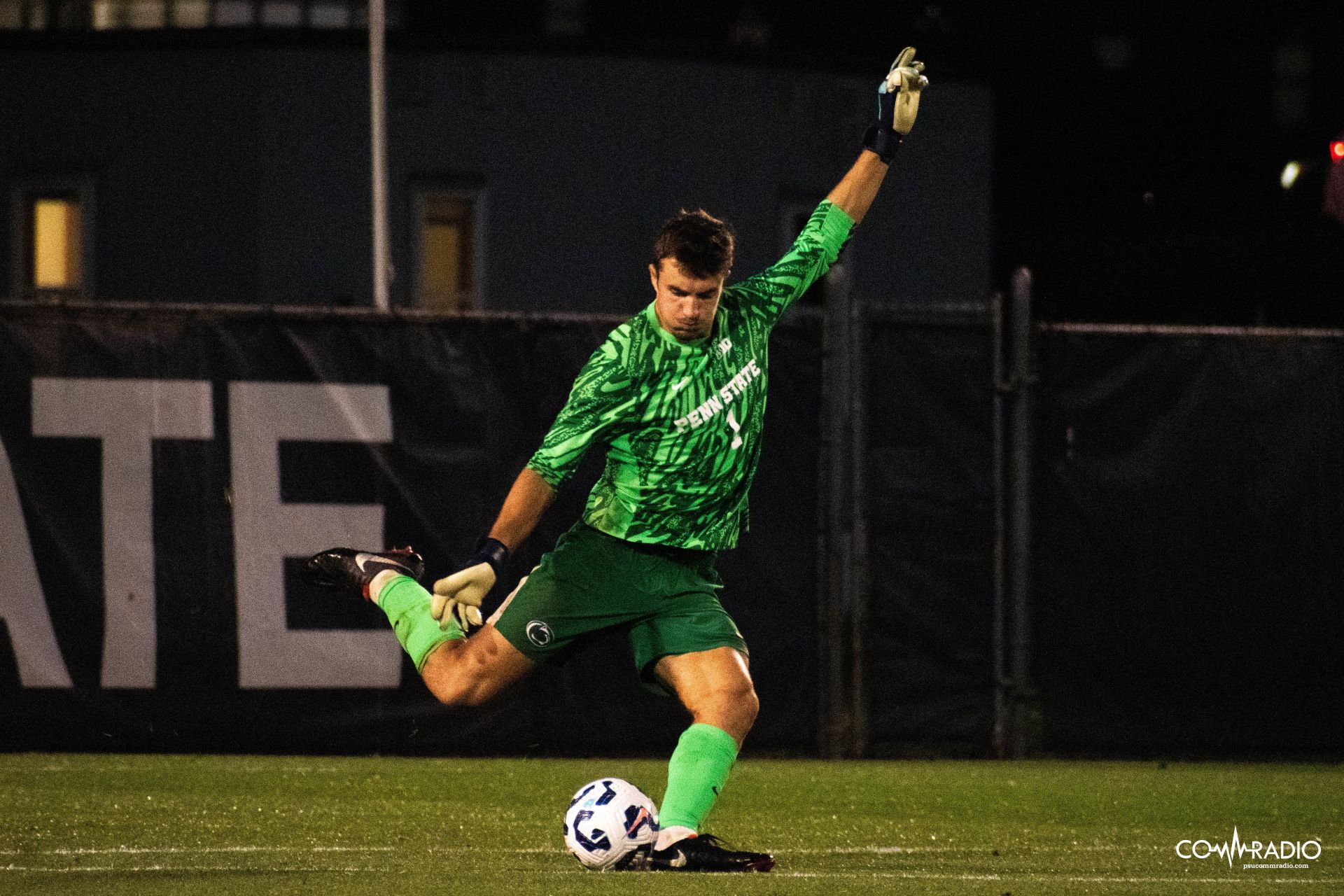 Cooke kicking soccer ball