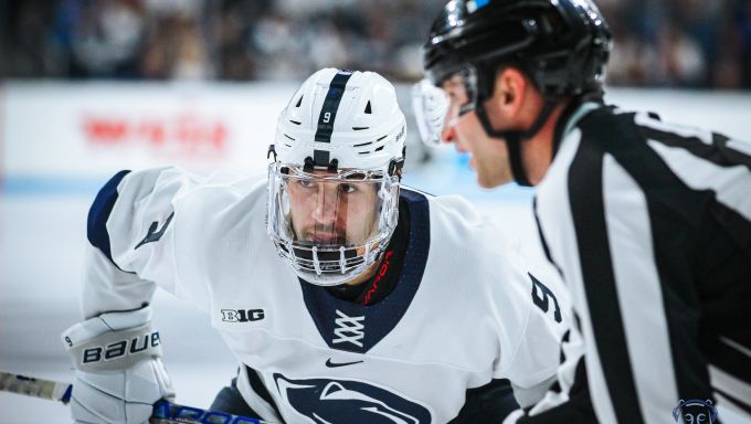 Xander Lamppa taking a faceoff against No. 1 Michigan