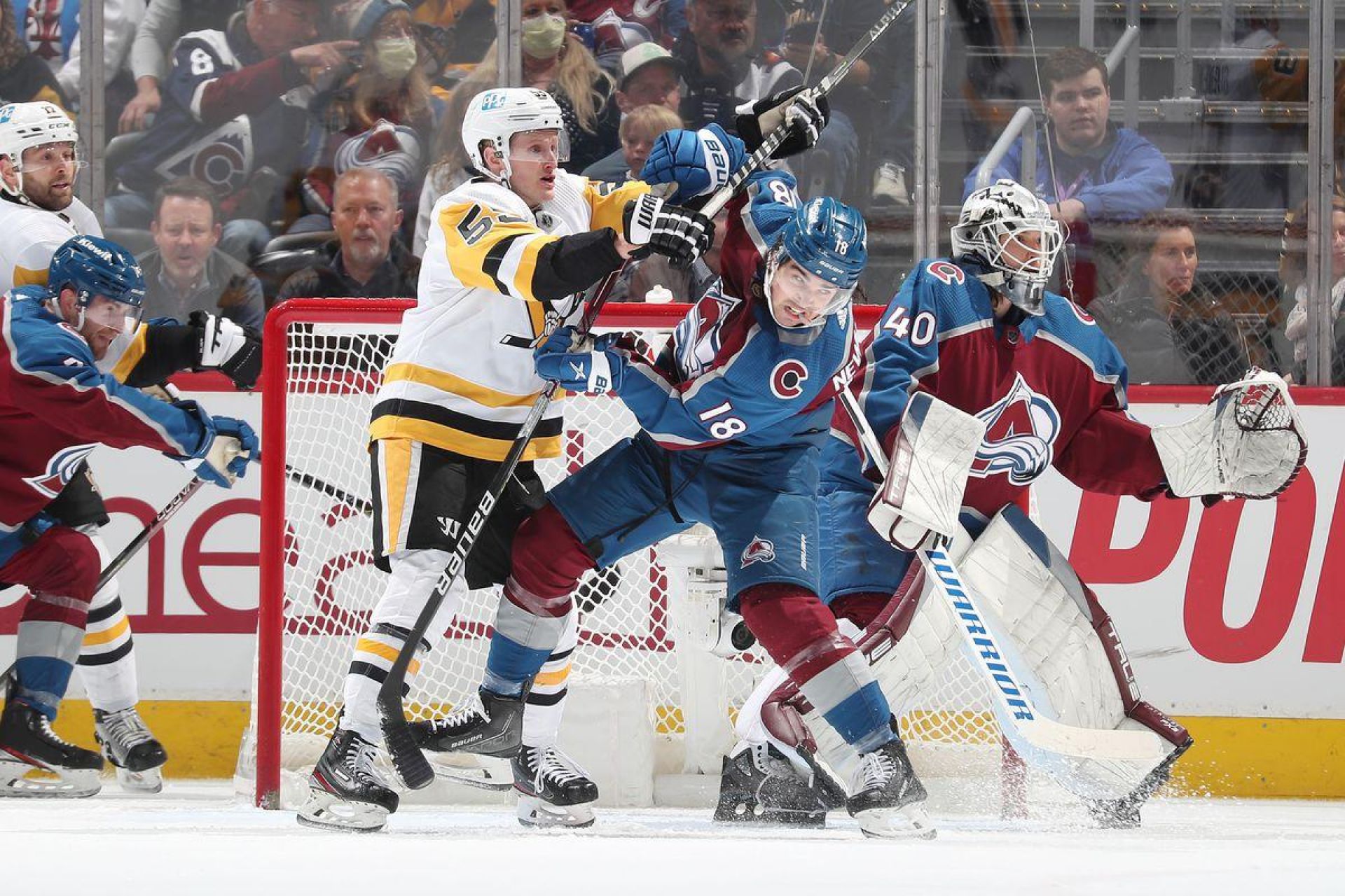Penguins and Avalanche battling in front of the net