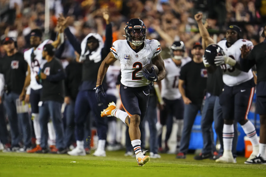 DJ Moore running towards the endzone against the Commanders