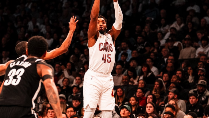 Donovan Mitchell shooting a three pointer