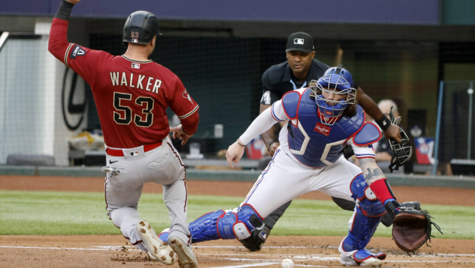 Christian Walker sliding home