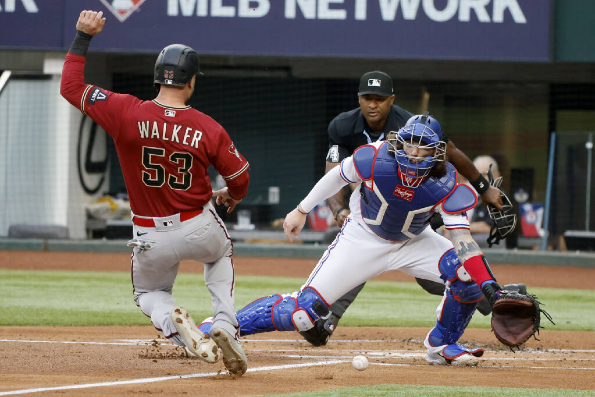 Christian Walker sliding home