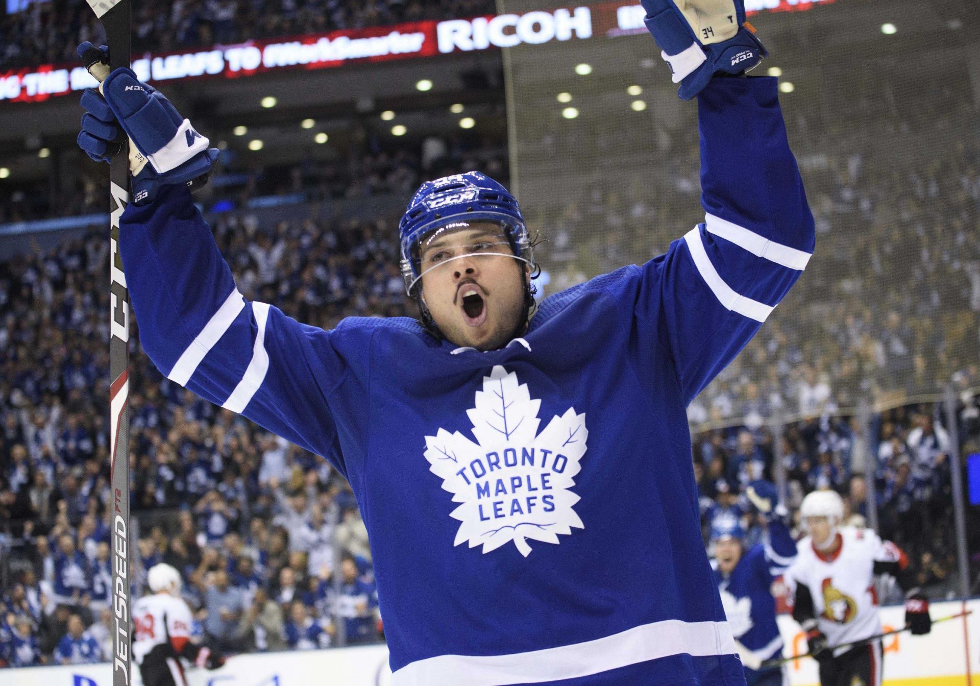Auston Matthews celebrates after scoring against the Ottawa Senators