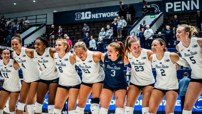 women's volleyball celebrating