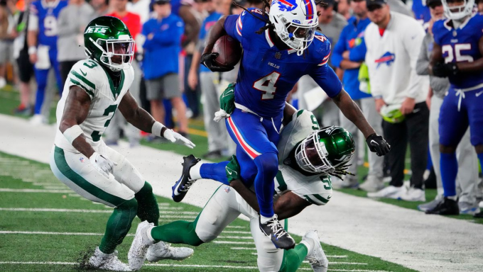 James Cook rushing against the Jets