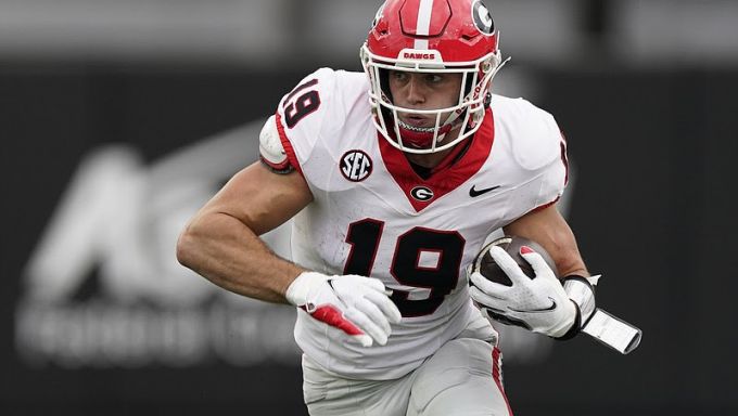 Bowers running with football