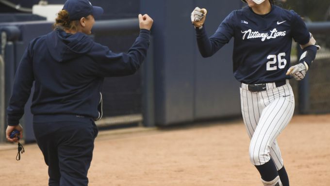 Liana Jones celebrating with her third base coach