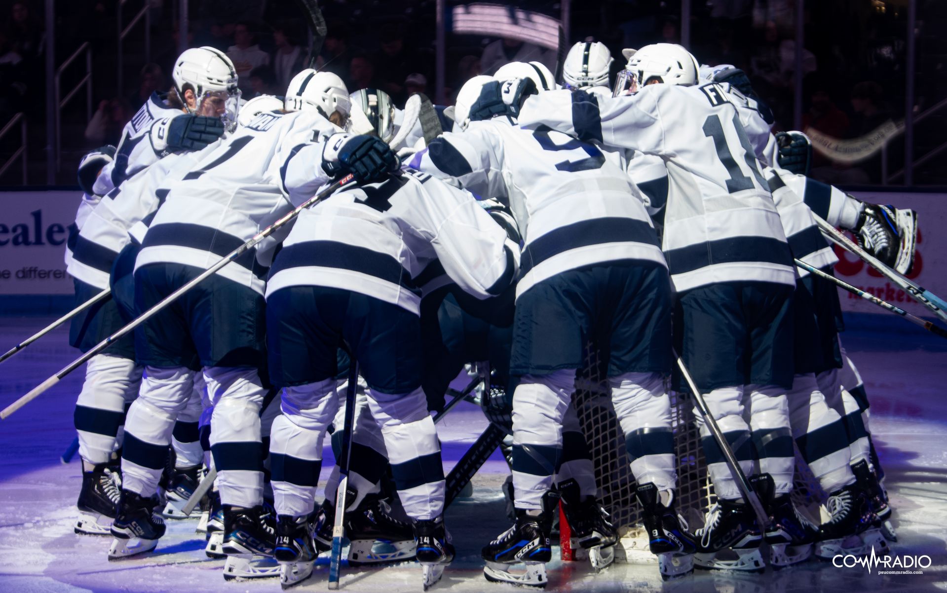 Men's hockey in a huddle