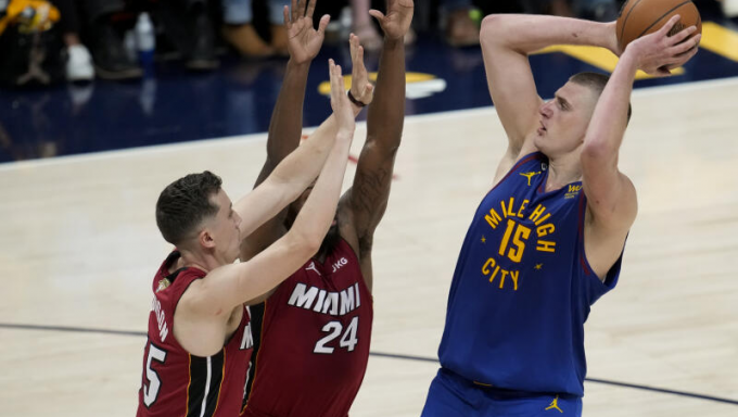 Jokic taking a shot against the Heat
