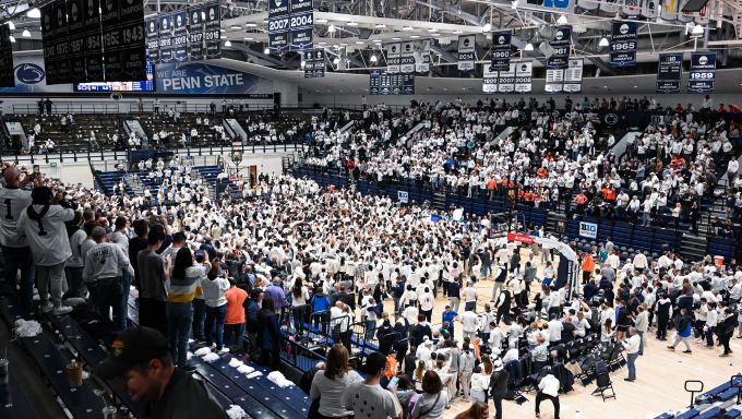 Penn State fans storming the court after beating No. 12 Illinois 80-79