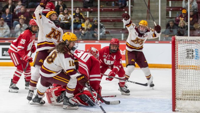 Minnesota scoring on Wisconsin to advance to WCHA title game