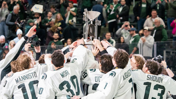 Michigan State hockey celebrating after beating Michigan