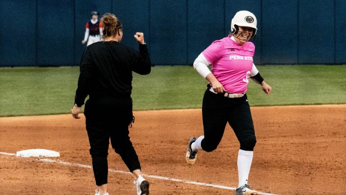Gaby Garcia rounding third after her grand slam against Bucknell