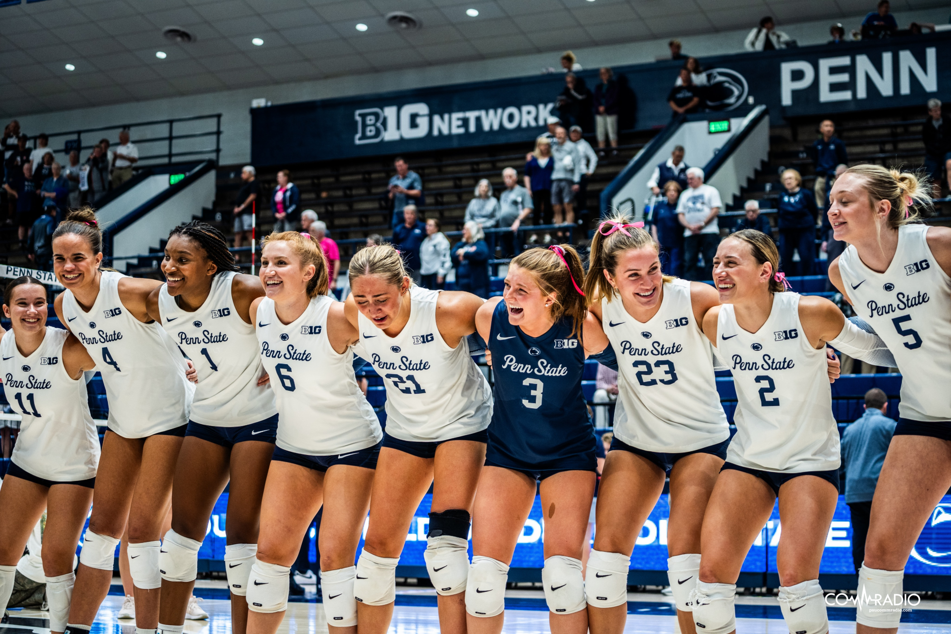 women's volleyball celebrating