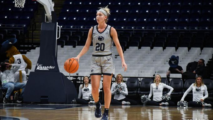 Makenna Marisa taking the ball up court against Radford
