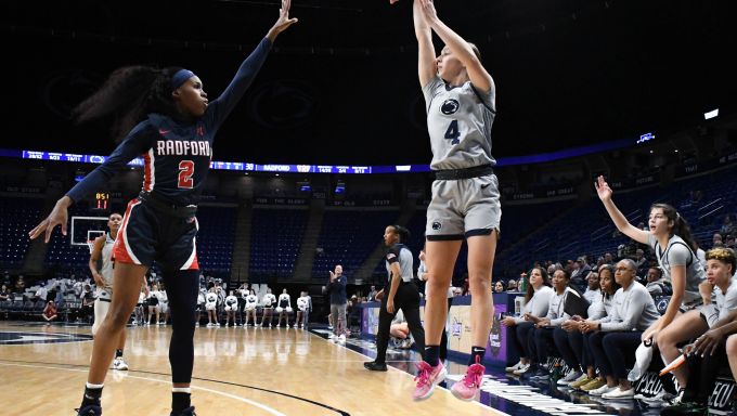Shay Ciezki rising for a three pointer against Radford