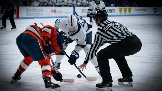 Penn State's Tessa Janecke trying to win a faceoff against Syracuse
