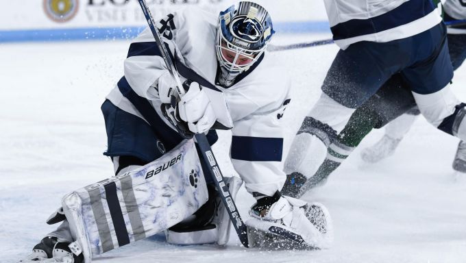 Katie DeSa freezing the puck against Mercyhurst