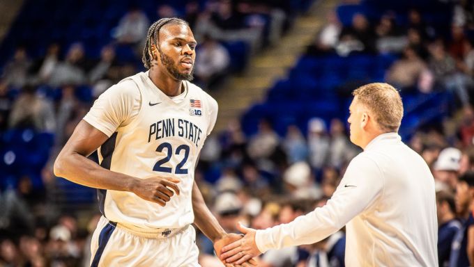 Mike Rhoades giving Qudus Wahab a high five