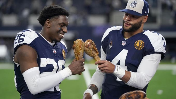 Dak Prescott and Bland celebrating after a big Thanksgiving win