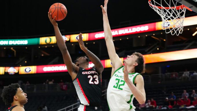 Georgia Bulldogs forward Jalen DeLoach (23) shoots against Oregon Ducks center Nate Bittle (32) during the second half at T-Mobile Arena