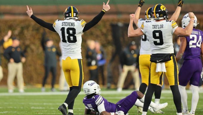 Iowa kicker celebrating after hitting game winning field goal
