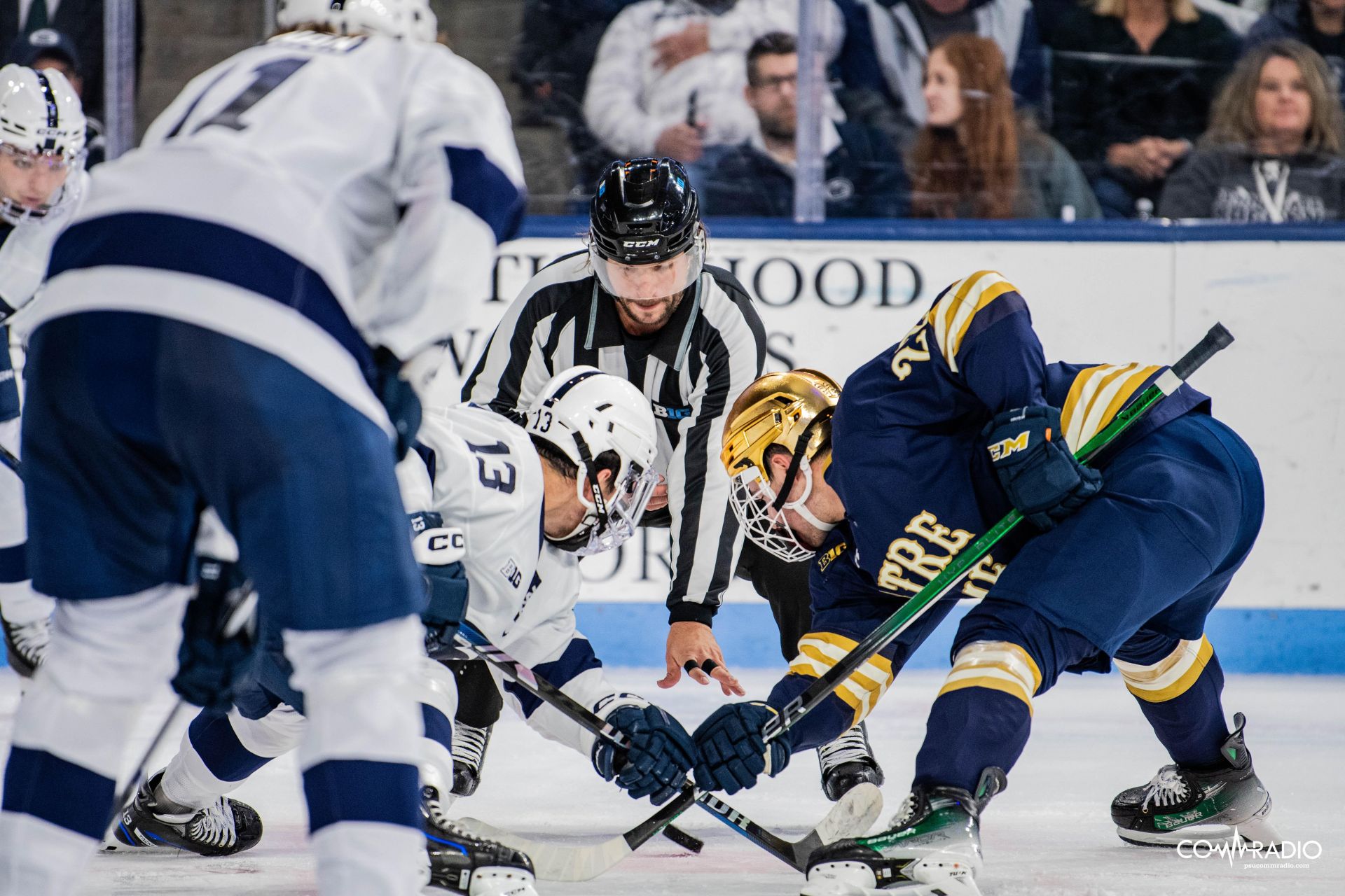 Danny Dzhaniyev taking a faceoff against Notre Dame