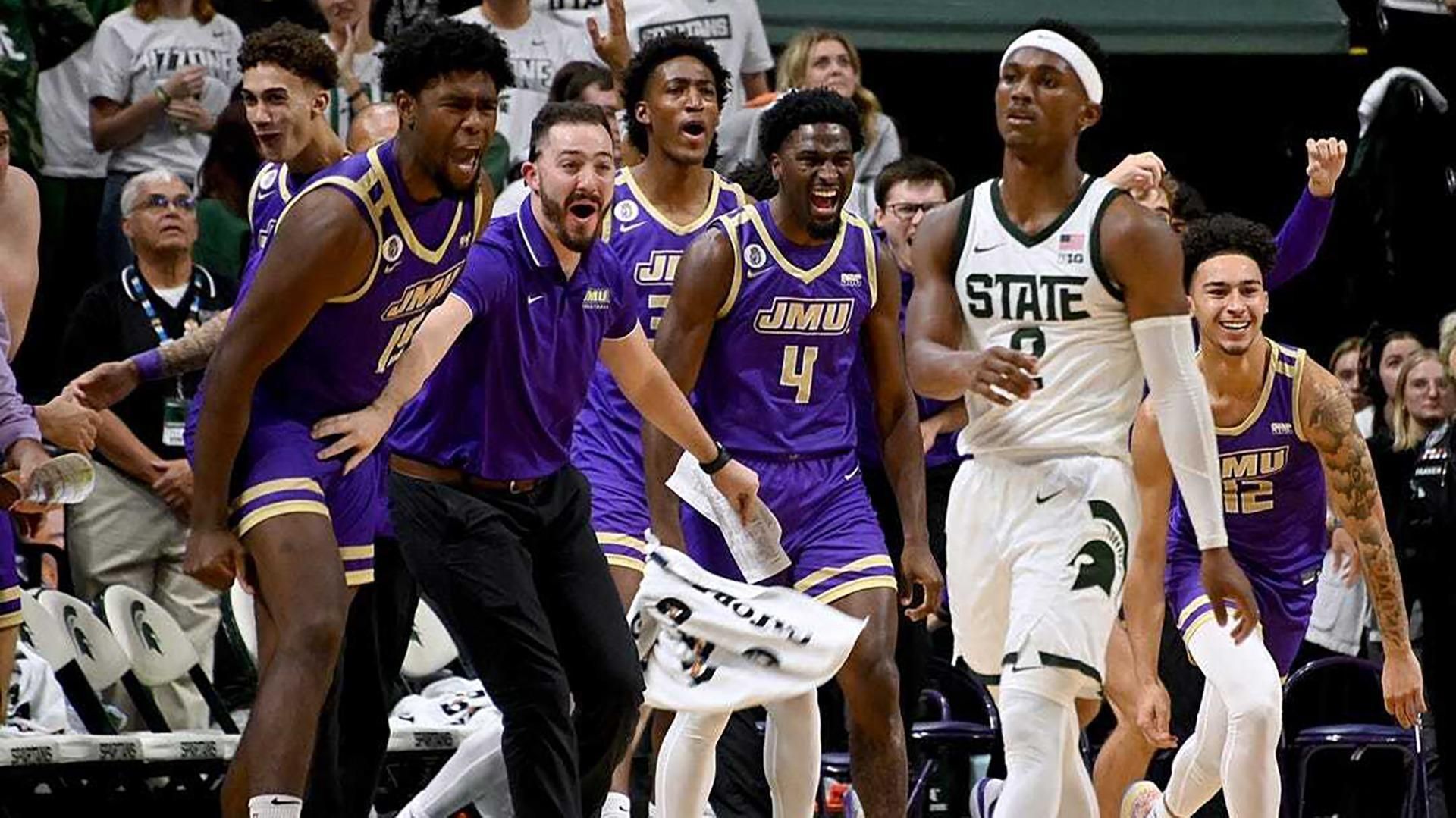 James Madison Basketball celebrating over Michigan State