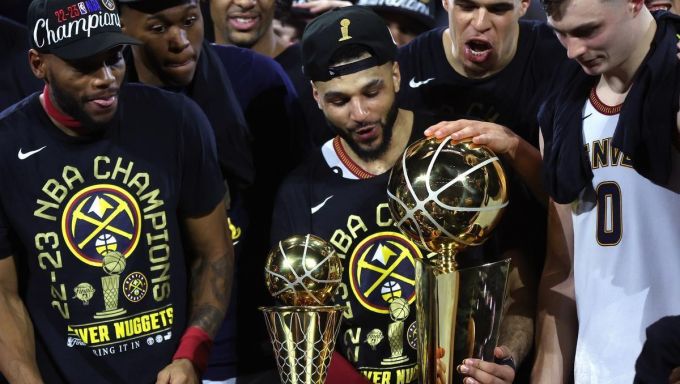 Jamal Murray holding NBA Finals Trophy