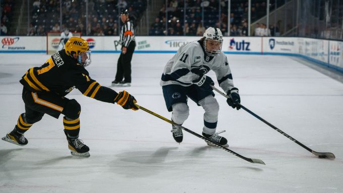 Ryan Kirwan Skating in the Offensive Zone against AIC
