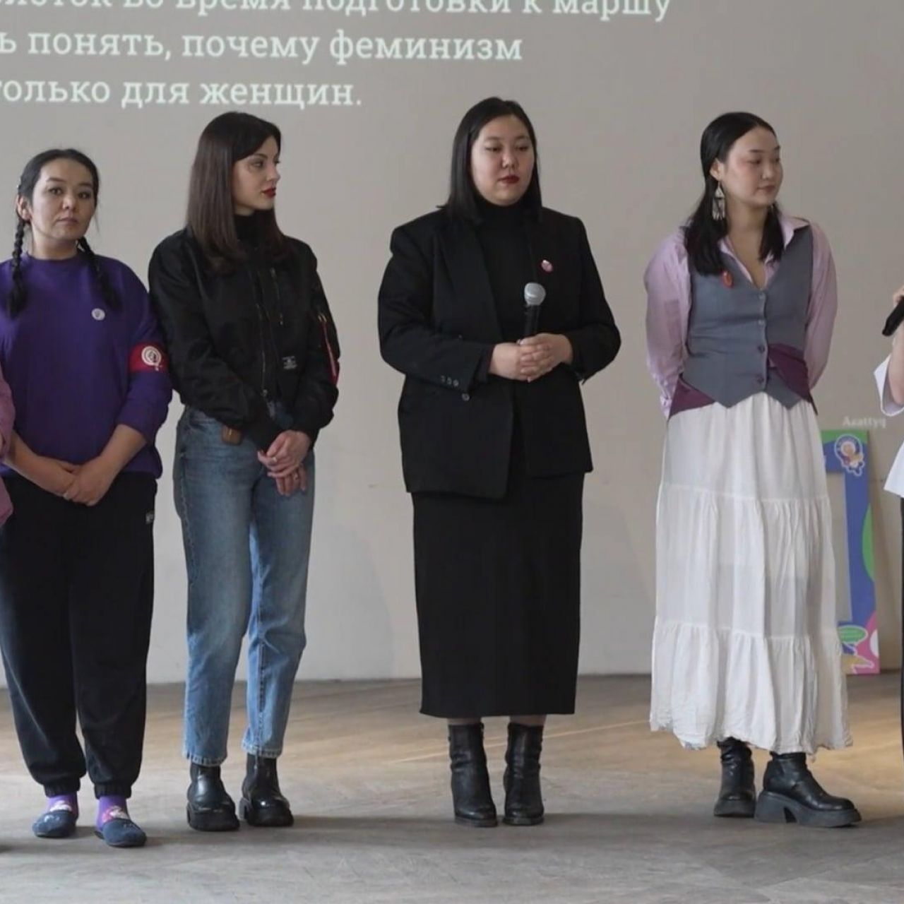 A group of women in Kazakhstan speaking at an event for domestic violence awareness
