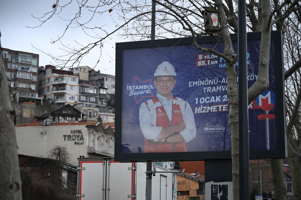 A campaign billboard for incumbent Istanbul Mayor Ekrem İmamoğlu sits next to the Fener metro stop on the bank of the Golden Horn in Istanbul. (Photo by Luke Vargas)