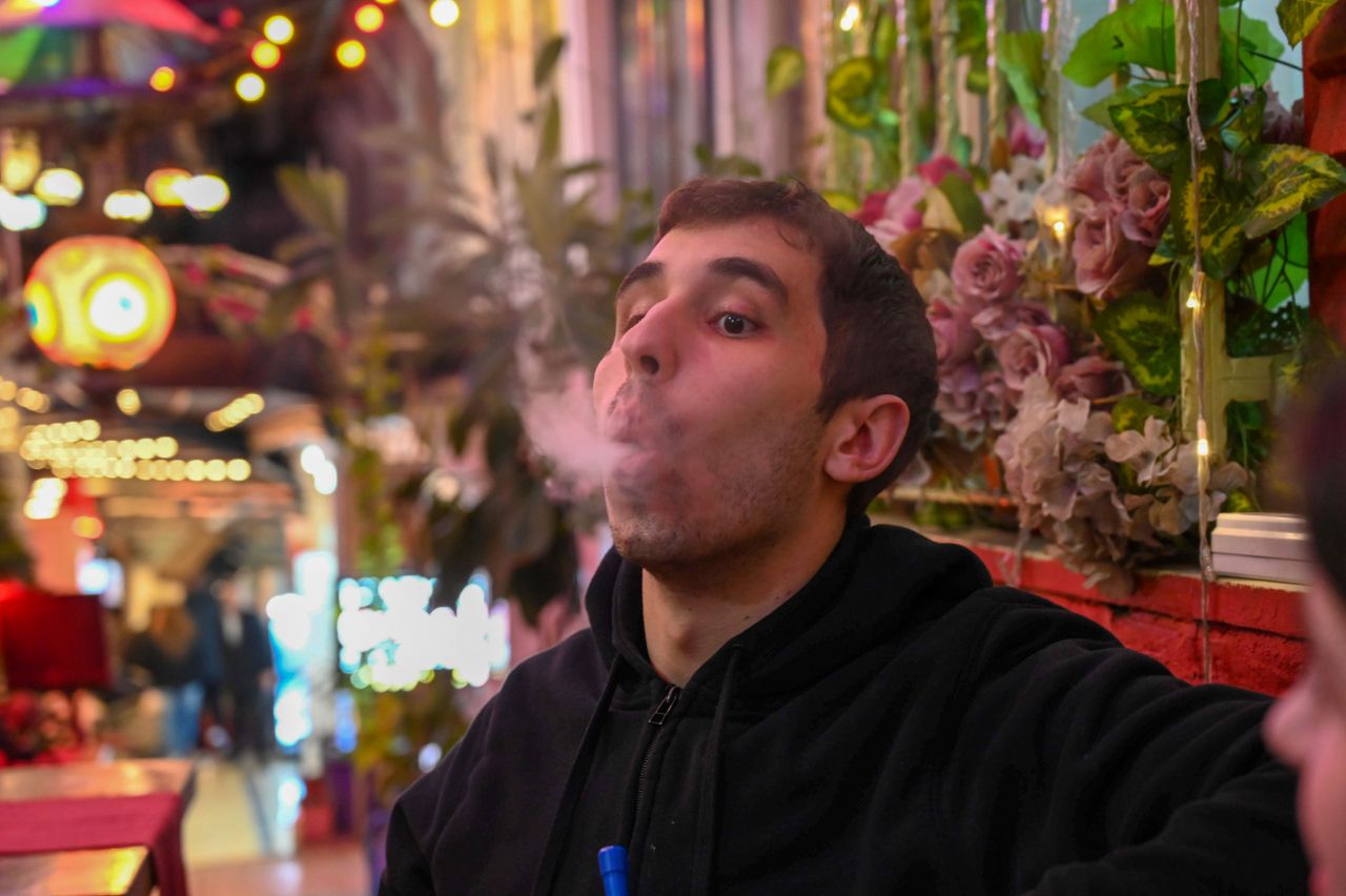 Nick Stonesifer takes a hit of shisha in Harab'be Cafe in Fatih, Istanbul. (Photo by Olivia Estright)