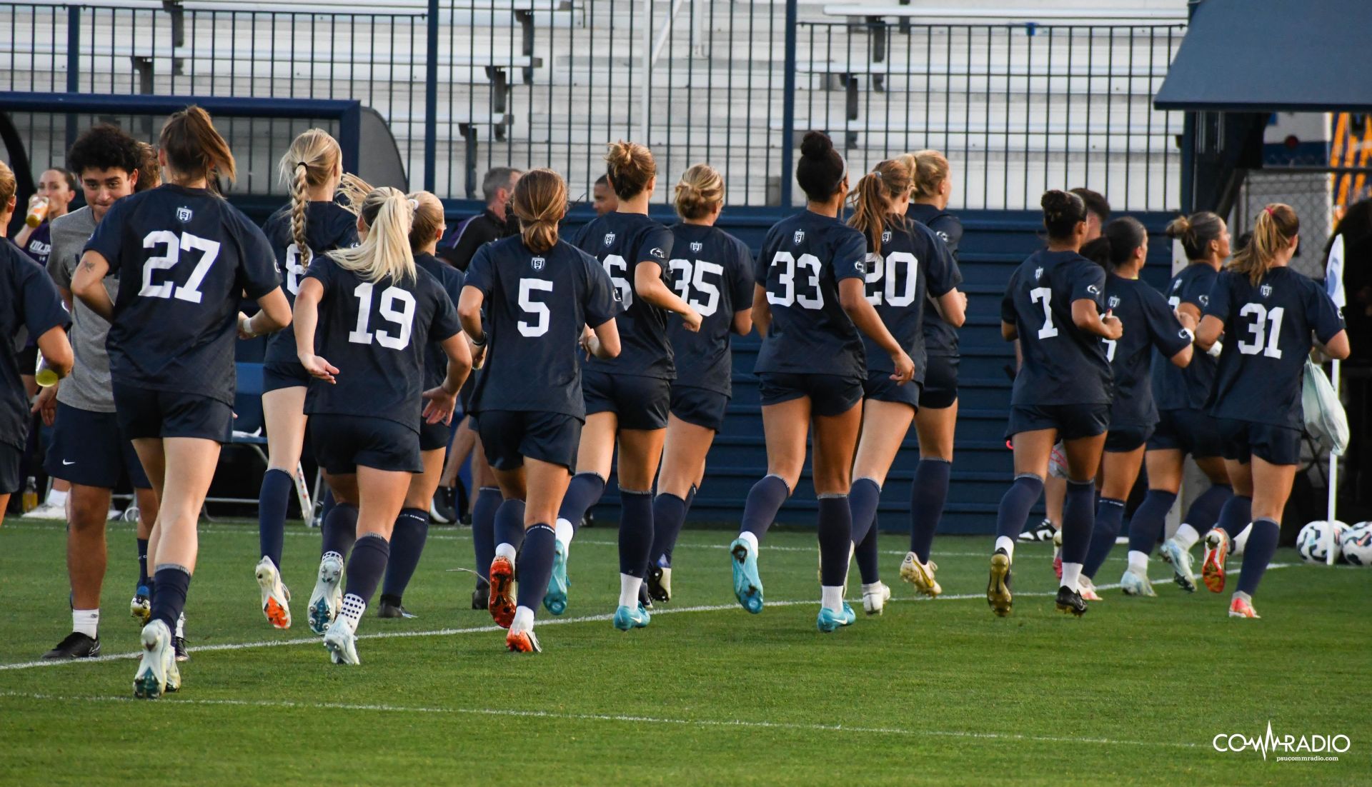 womens soccer running on the field