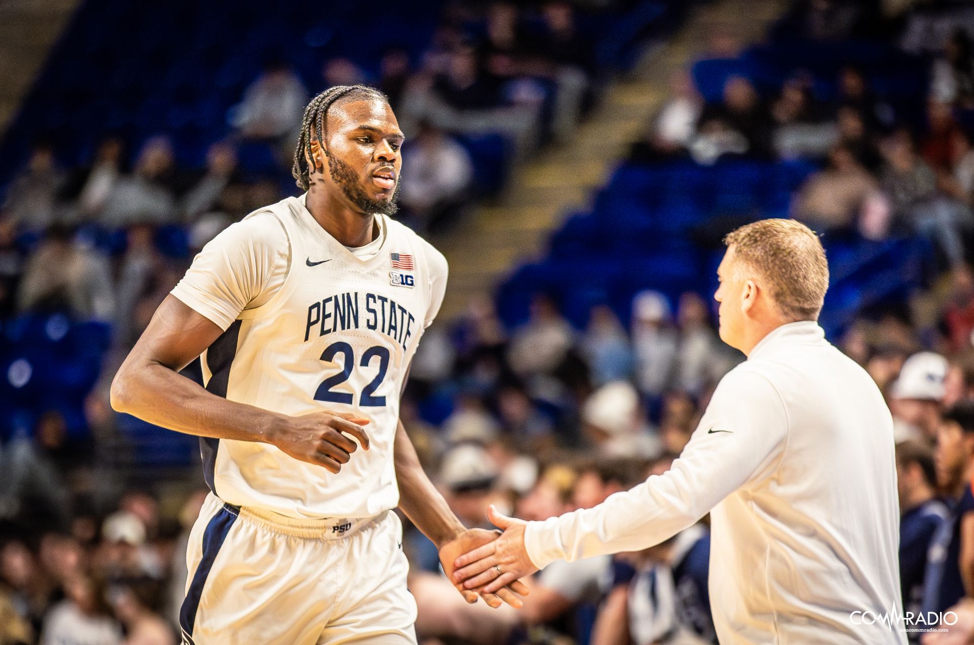 Mike Rhoades giving Qudus Wahab a high five