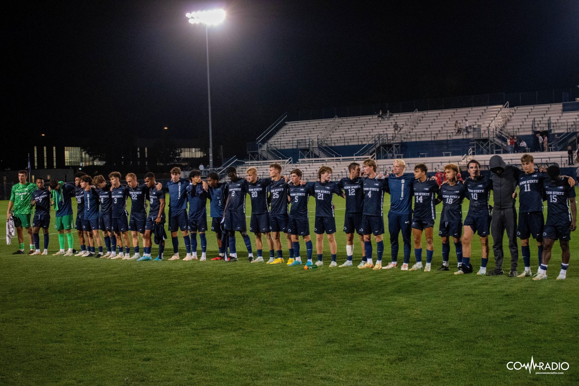 men's soccer in a line