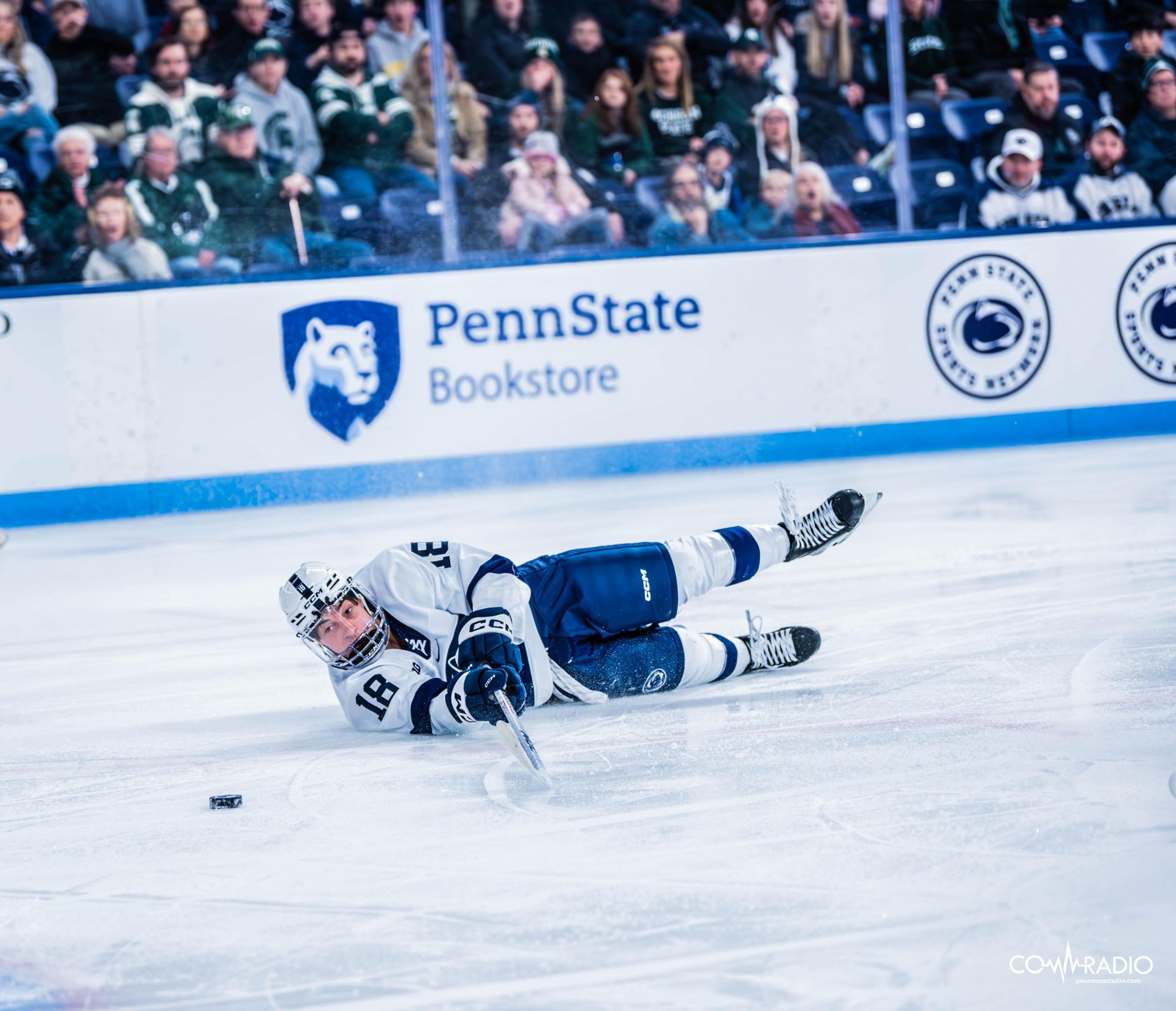 Aiden Fink falling to the ice against Michigan State