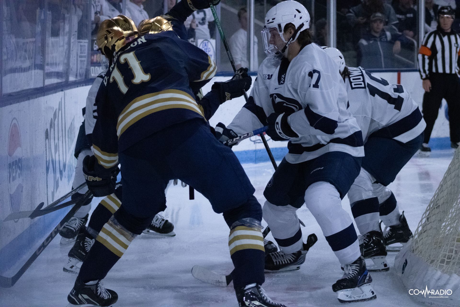 Penn State and Notre Dame battling for the puck