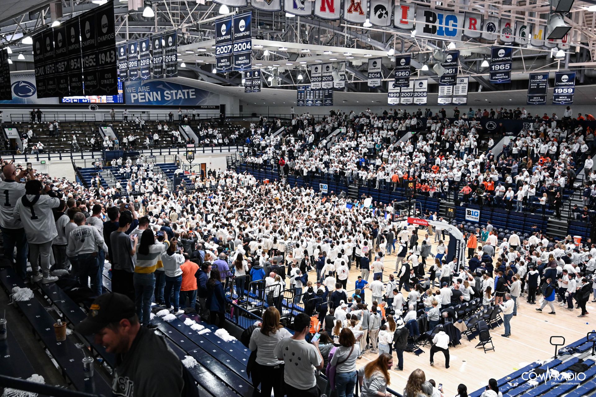 Penn State fans storming the court after beating No. 12 Illinois 80-79