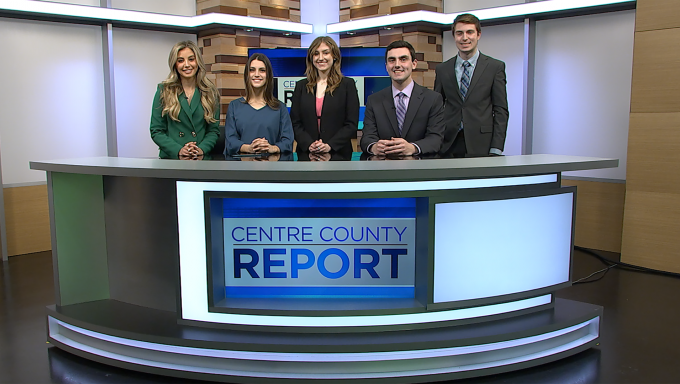 anchors and reporters standing behind the centre county report anchor desk