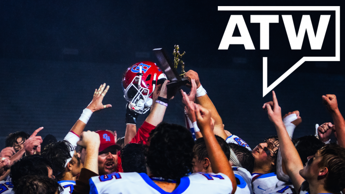 Cambria Heights Red Dragon football team raising their District 6 1A championship trophy over their heads