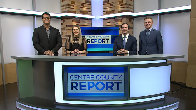 Four Centre County Report Anchors standing behind the Centre County Report anchor desk