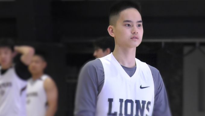 Arthur Chou plays point guard for the Penn State asian student basketball team. Here he is in a game wearing his Lions jersey.