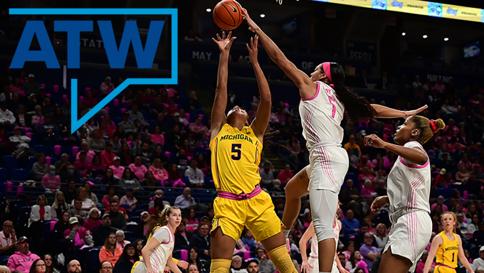 A Penn State women's basketball player rejecting a Michigan player