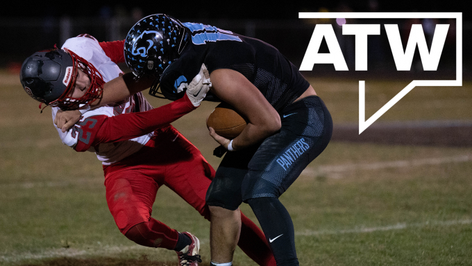 Penn Cambria player stiff arms a Central defender