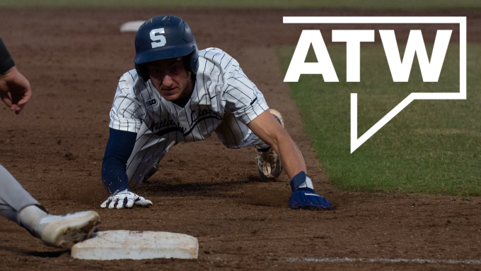 Penn State base runner sliding into third base as the throw comes in from St. Bonaventure