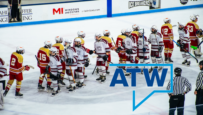 Bishop McCort and State High club hockey players shaking hands after a game