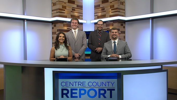 Four Centre County Report anchors standing behind the Centre County Report