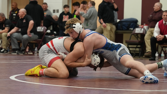 Dalton Perry brings his opponent down to the mat and looks for the takedown